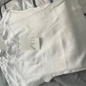 T short Zara New size M runs small like a XS I bought online too small for me.